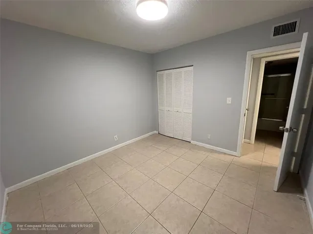 an empty room with a fireplace