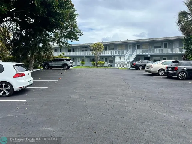 a view of parking space with parked cars