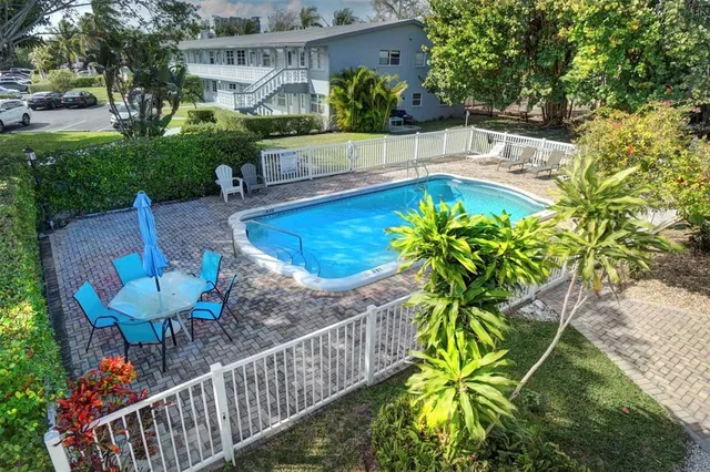a view of a backyard with plants and garden