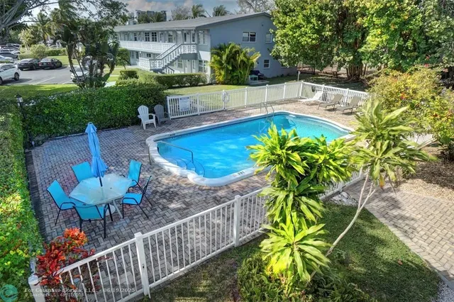 a view of a backyard with plants and garden