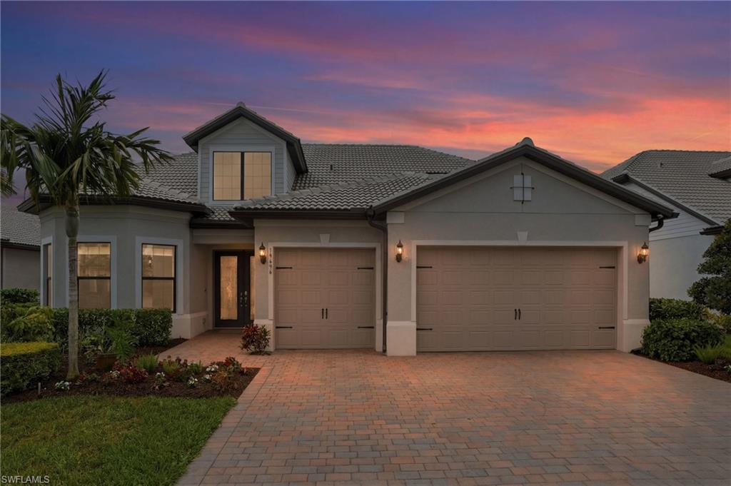 19696 Aqua View Lane Fort Myers, FL 33913 - Photo 41 of 50 a front view of house with garage and yard
