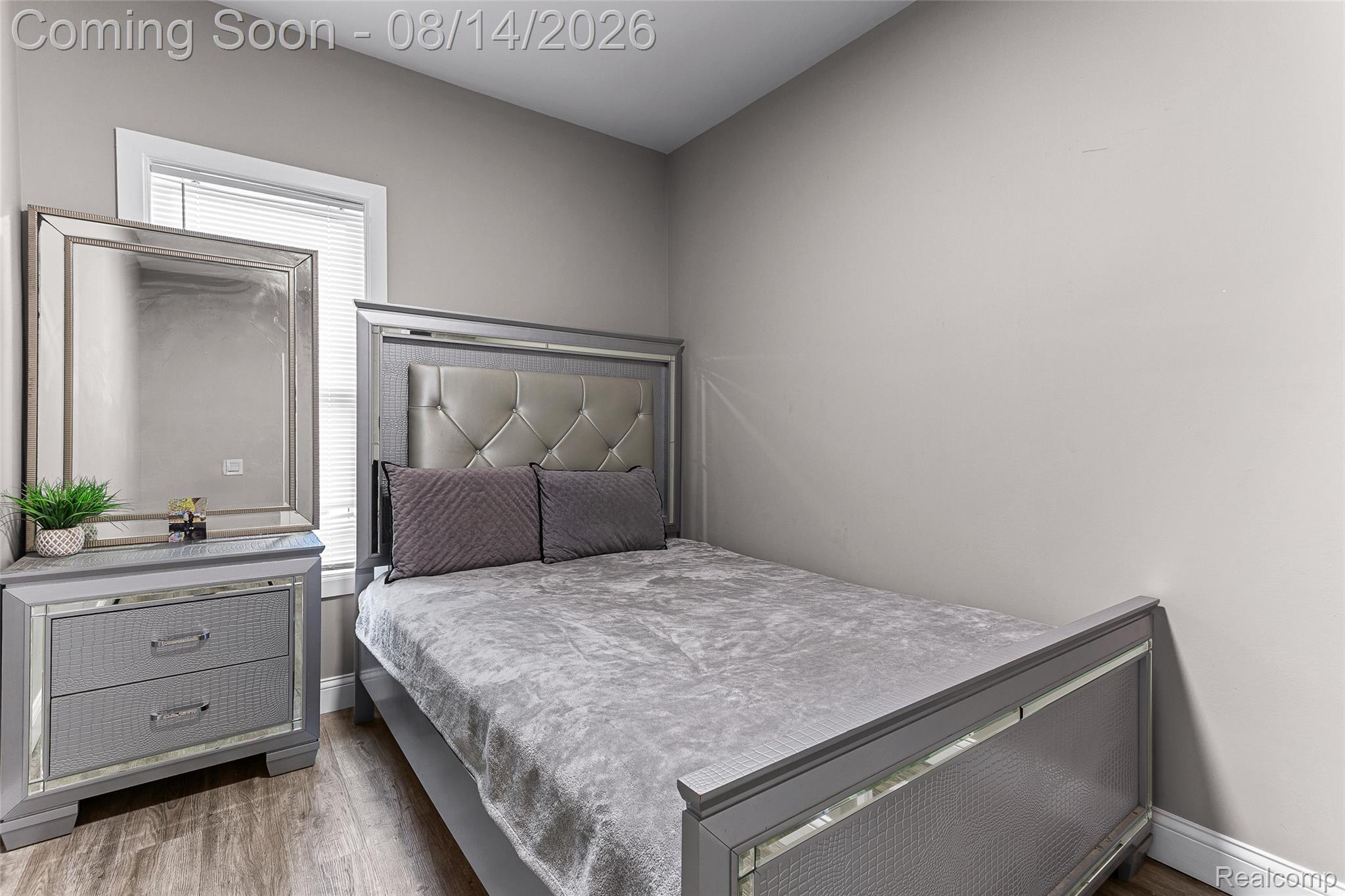 4472 French Road Detroit, MI 48214 - Photo 17 of 23 Wood-finish flooring, neutral wall tones, and a window with blinds