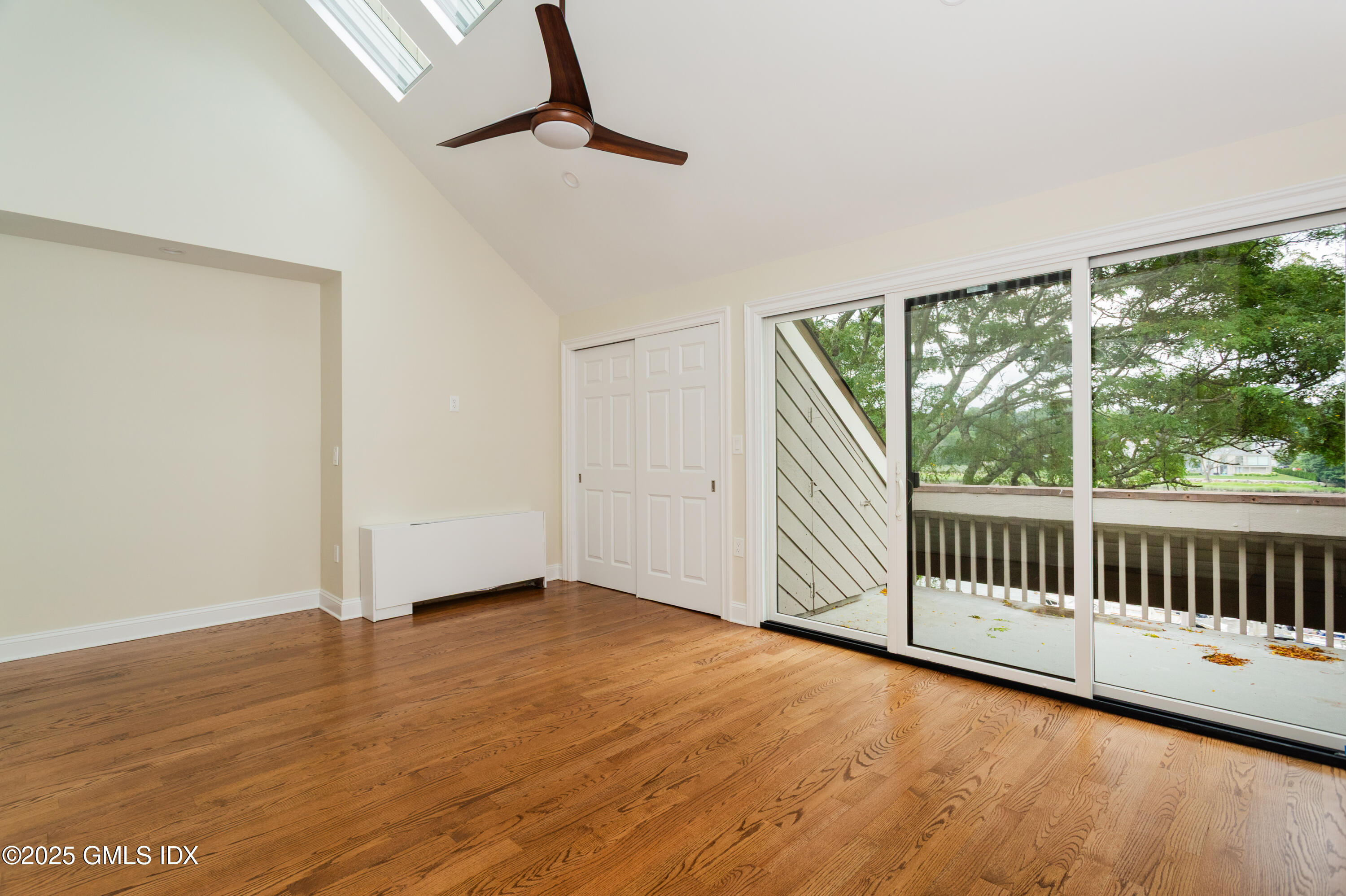 15 River Road, Unit 220 Cos Cob, CT 06807 - Photo 14 of 27 a view of a room with wooden floor fan and windows