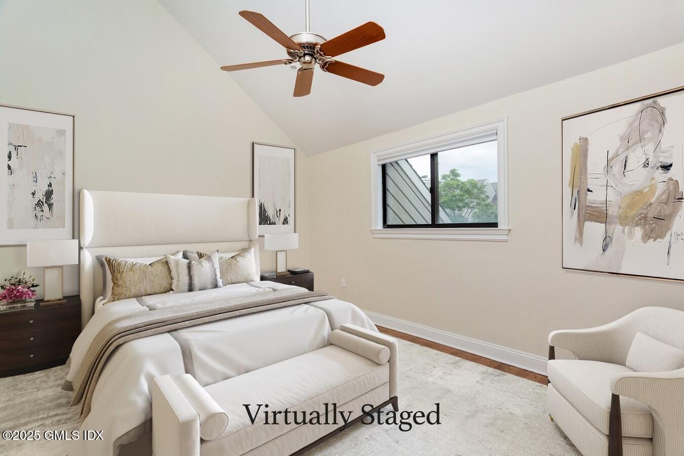 15 River Road, Unit 220 Cos Cob, CT 06807 - Photo 16 of 27 a bedroom with a bed and wooden floor