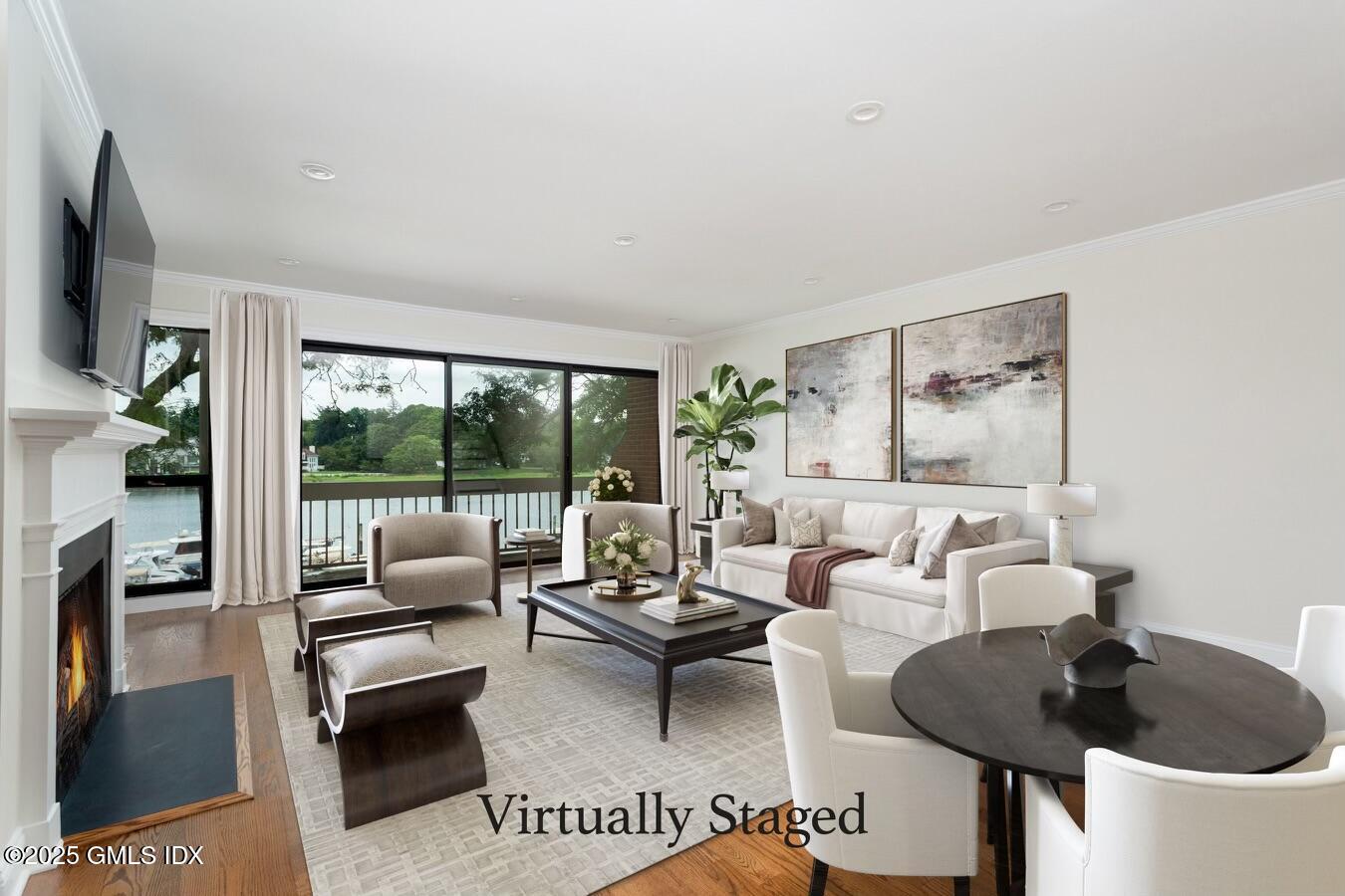 15 River Road, Unit 220 Cos Cob, CT 06807 - Photo 2 of 27 a living room with furniture and a floor to ceiling window