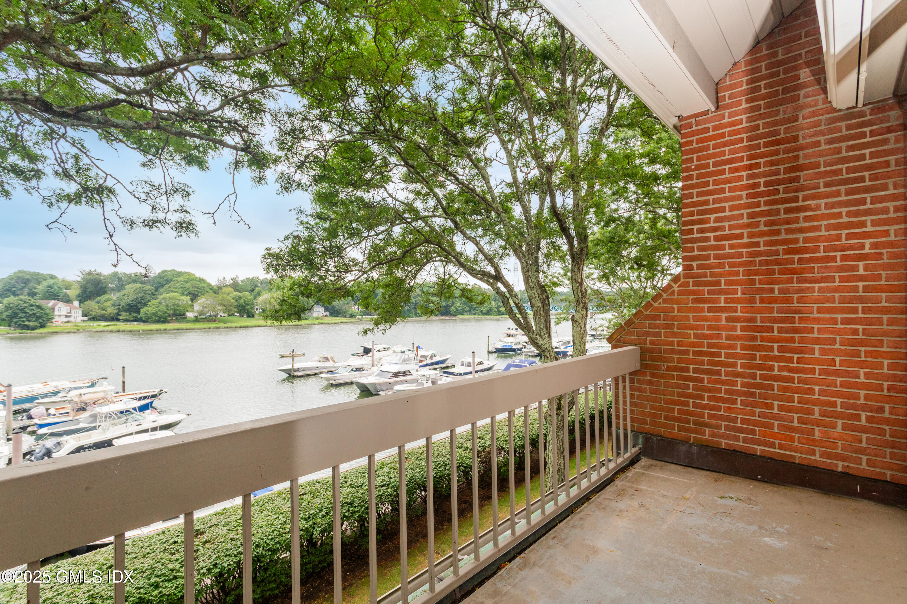 15 River Road, Unit 220 Cos Cob, CT 06807 - Photo 10 of 27 a view of a balcony with lake view