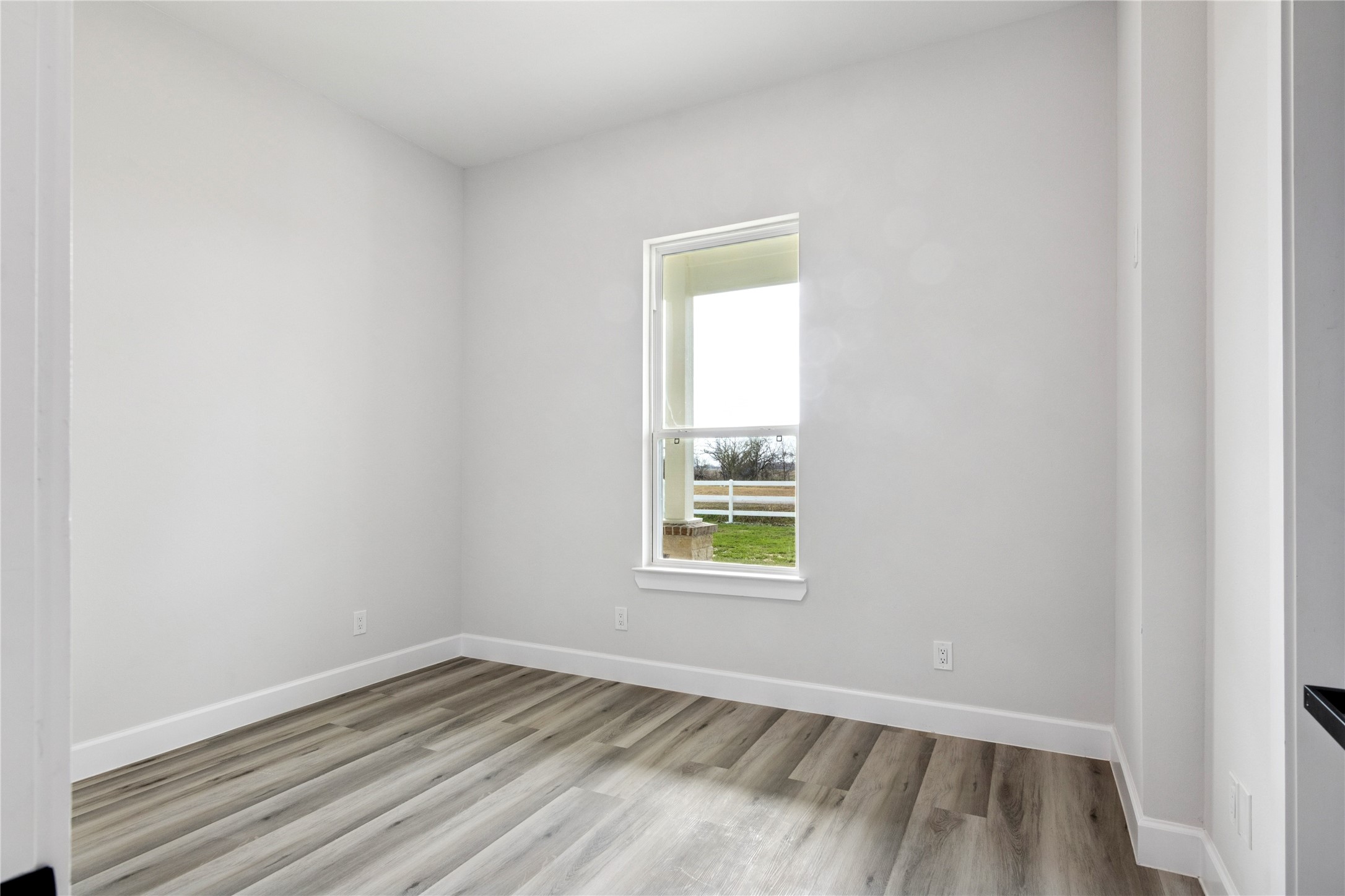 5766 Ward Bend Road Sealy, TX 77474 - Photo 20 of 45 an empty room with a window