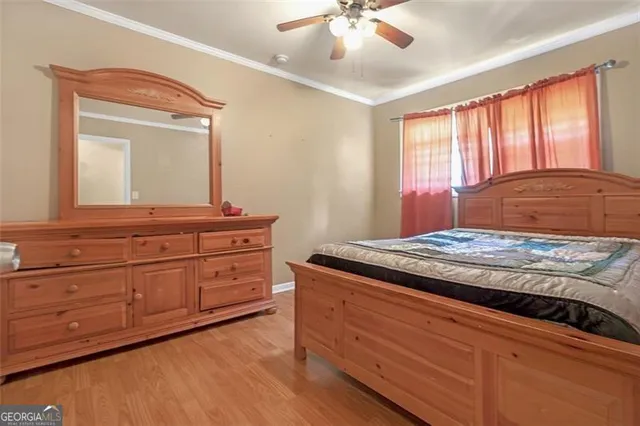 a bedroom with a bed and a dresser