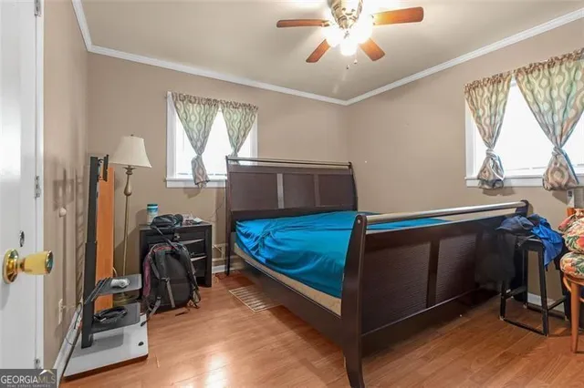 a bedroom with furniture and a window