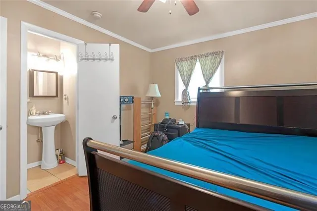 a room with wooden floor and windows