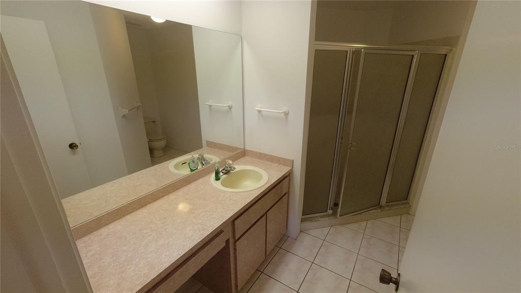 6421 Remus Drive New Port Richey, FL 34653 - Photo 19 of 25 a bathroom with a sink and a mirror