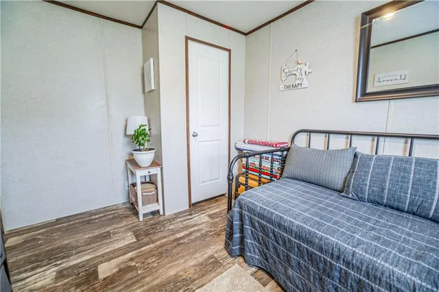 a bedroom with a bed and a table