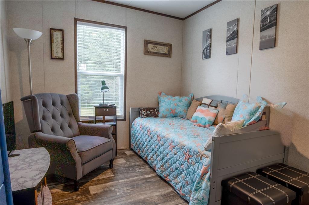 127 Georgia Drive Hartwell, GA 30643 - Photo 17 of 21 a bedroom with a bed couch and a window