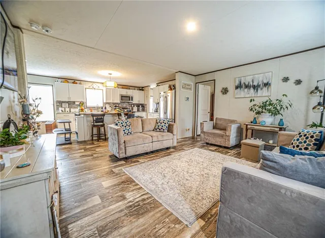 a living room with furniture and a view of living room
