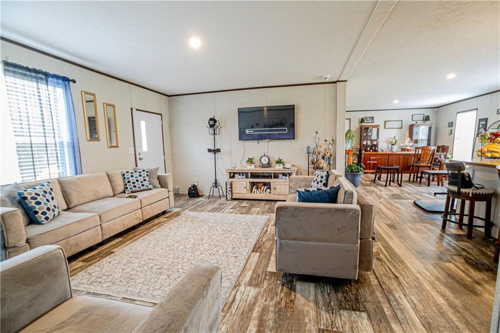 127 Georgia Drive Hartwell, GA 30643 - Photo 5 of 21 a living room with furniture and a flat screen tv