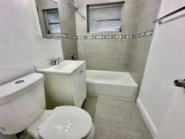 a view of room with window and hardwood floor