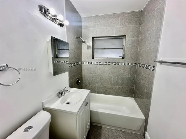 a view of backyard with seating space