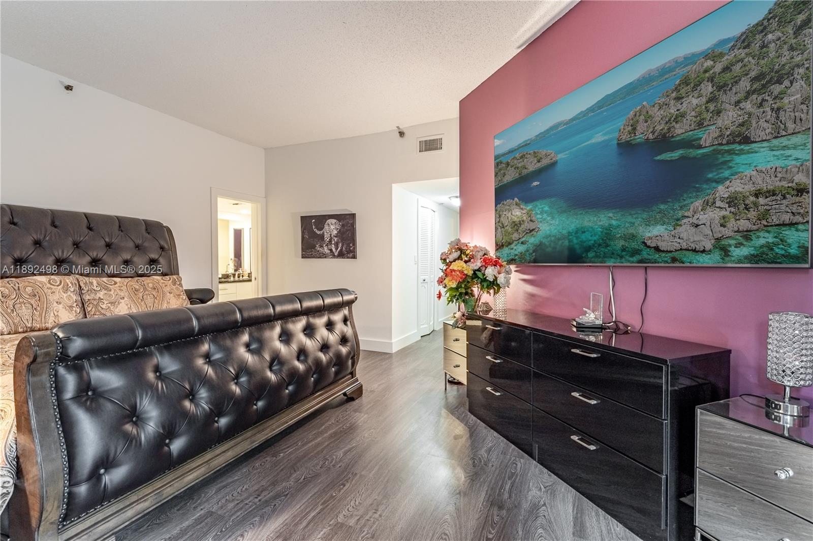 7300 Radice Court, Unit 109 Lauderhill, FL 33319 - Photo 11 of 35 a living room with furniture and a flat screen tv