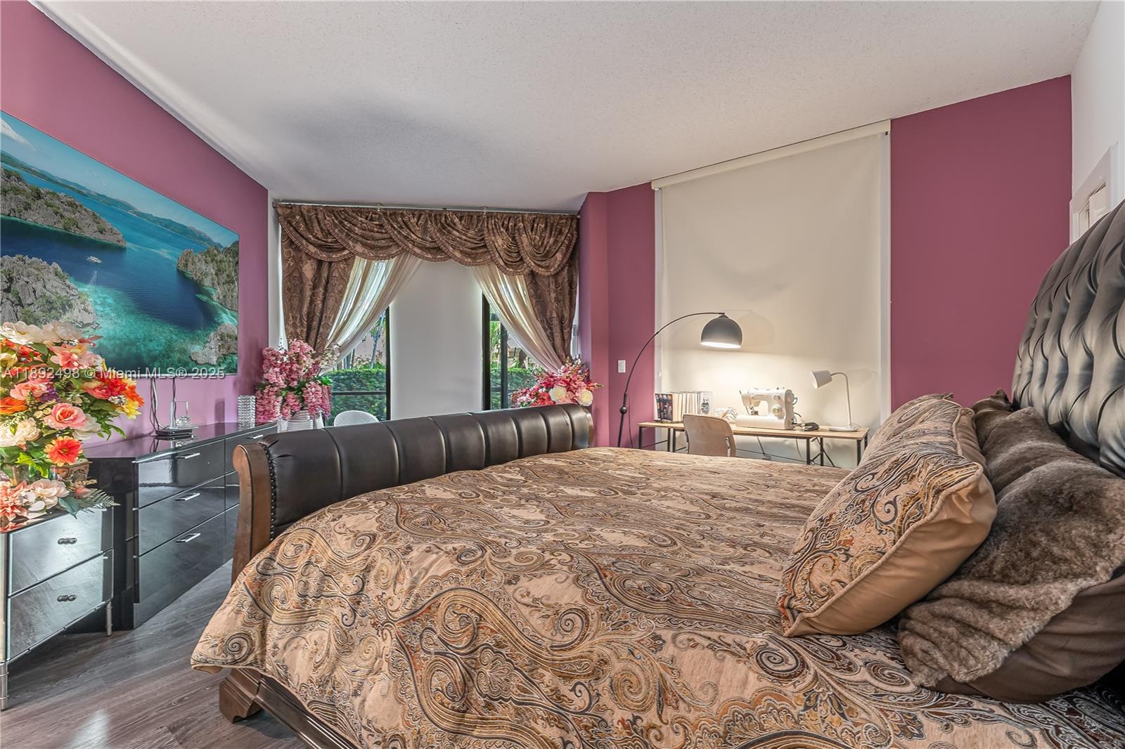 7300 Radice Court, Unit 109 Lauderhill, FL 33319 - Photo 12 of 35 a bedroom with a bed and a dresser