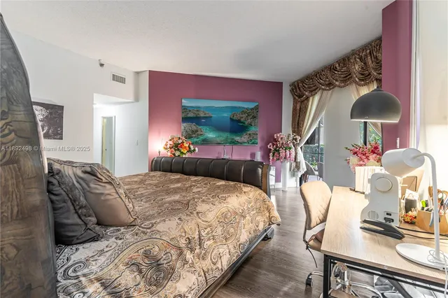 a bedroom with a bed and a table