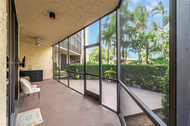 a building outdoor space with seating area and garden view
