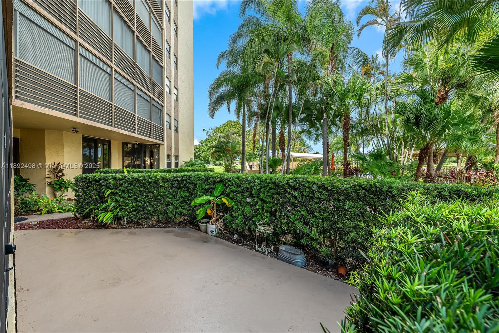 7300 Radice Court, Unit 109 Lauderhill, FL 33319 - Photo 26 of 35 a view of a garden with plants
