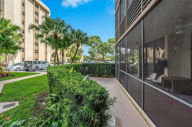 a view of a building with a yard