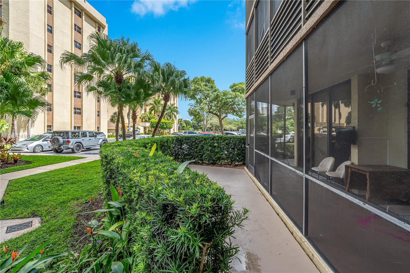 7300 Radice Court, Unit 109 Lauderhill, FL 33319 - Photo 27 of 35 a view of a building with a yard
