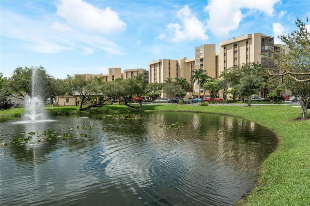 a view of a lake with a large building