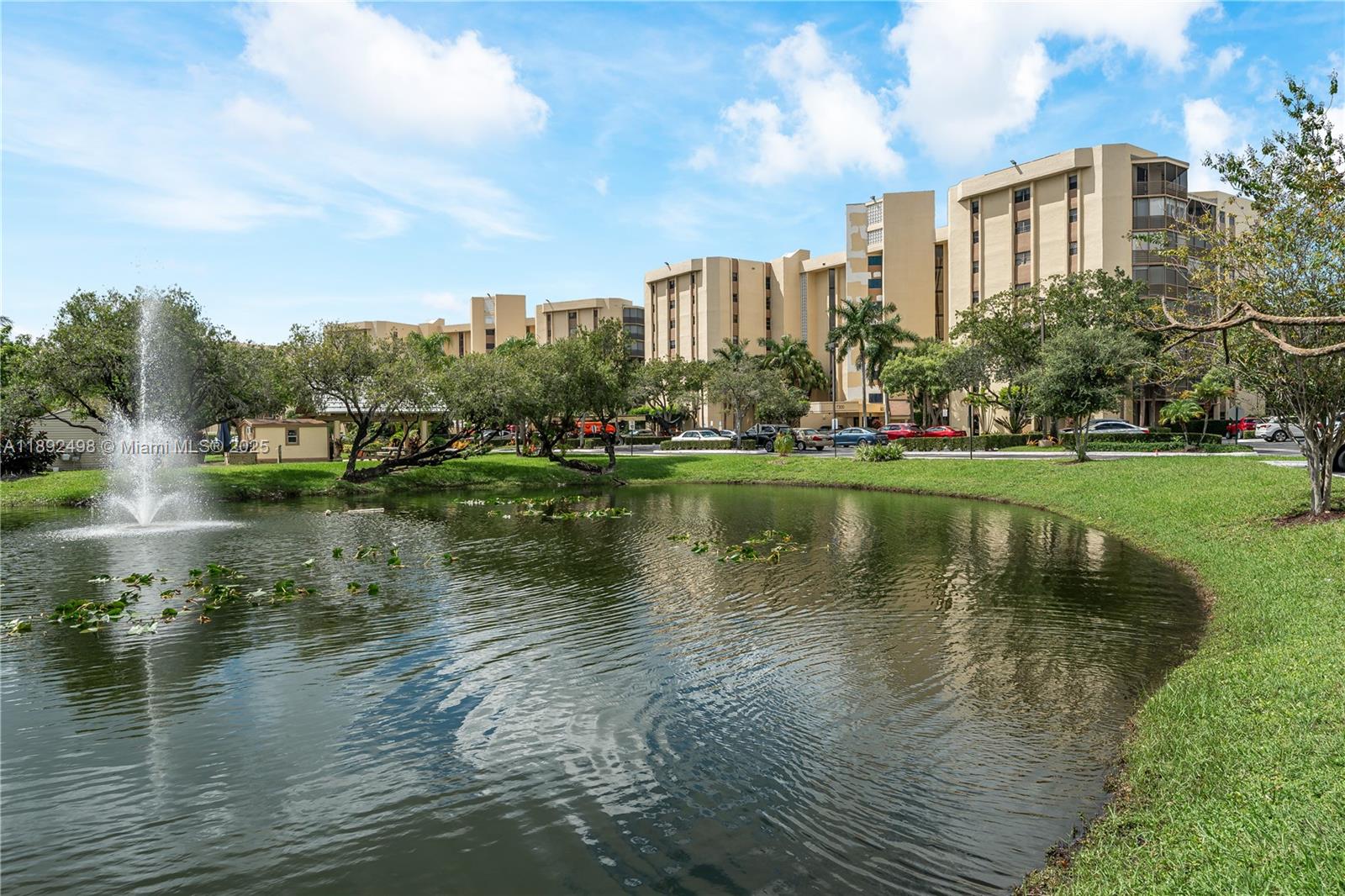 7300 Radice Court, Unit 109 Lauderhill, FL 33319 - Photo 30 of 35 a view of a lake with a large building