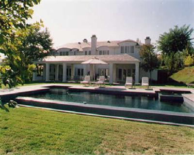 a view of a swimming pool with outdoor seating