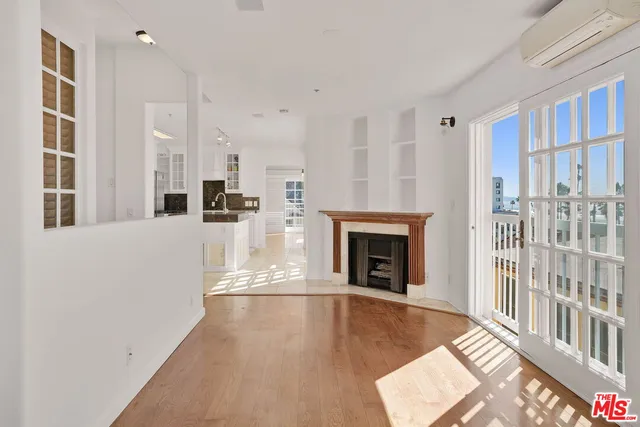 a view of a living room with windows