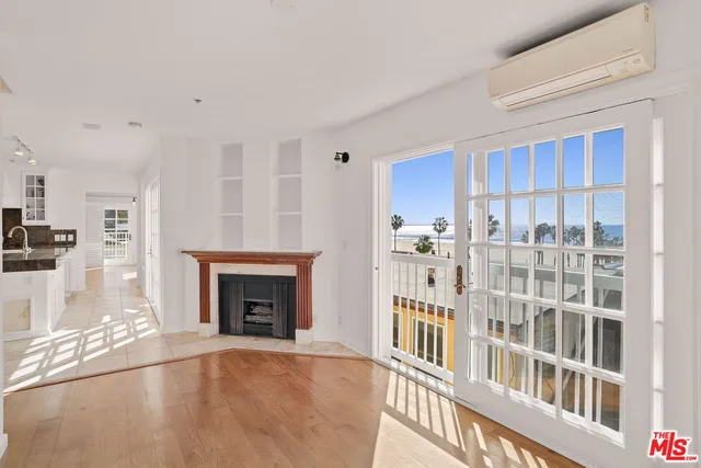 a living room with furniture a fireplace and a rug