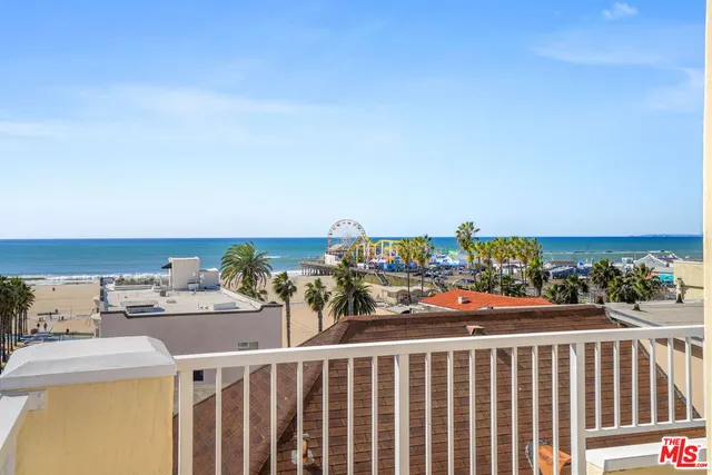 a view of a balcony with an outdoor seating