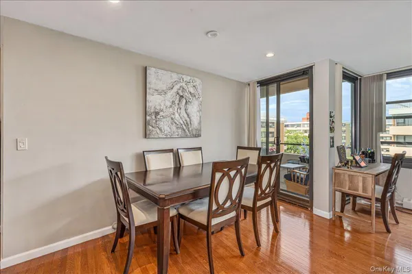 a view of a dining room with furniture and windows