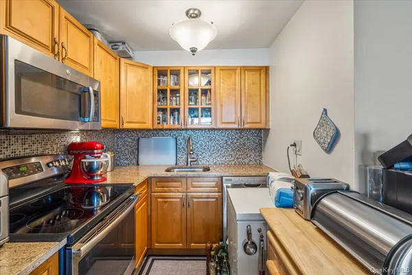 a kitchen with a stove and a microwave