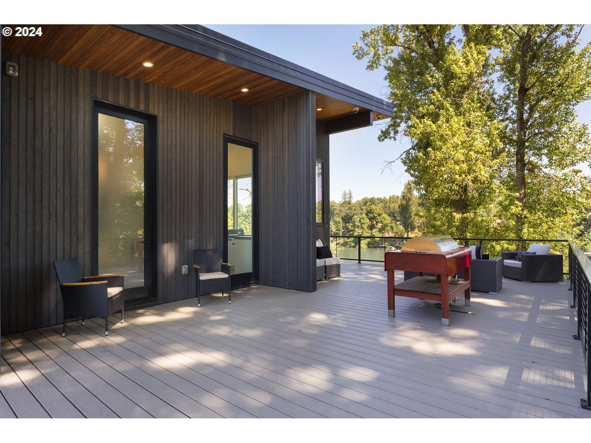 16450 Southwest Wilsonville Road Wilsonville, OR 97070 - Photo 3 of 40 a view of a patio with a table and chairs