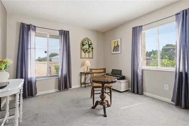 a workspace with furniture and window