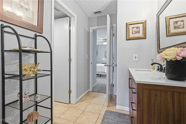 a dining room with furniture and a floor to ceiling window