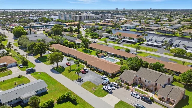 an aerial view of a house with garden space and lake view
