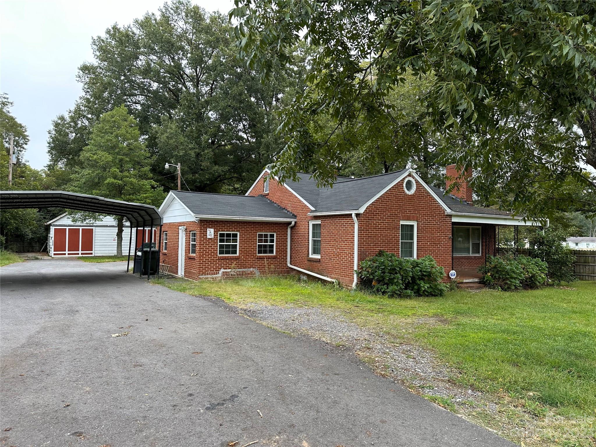 a front view of a house with yard and garage