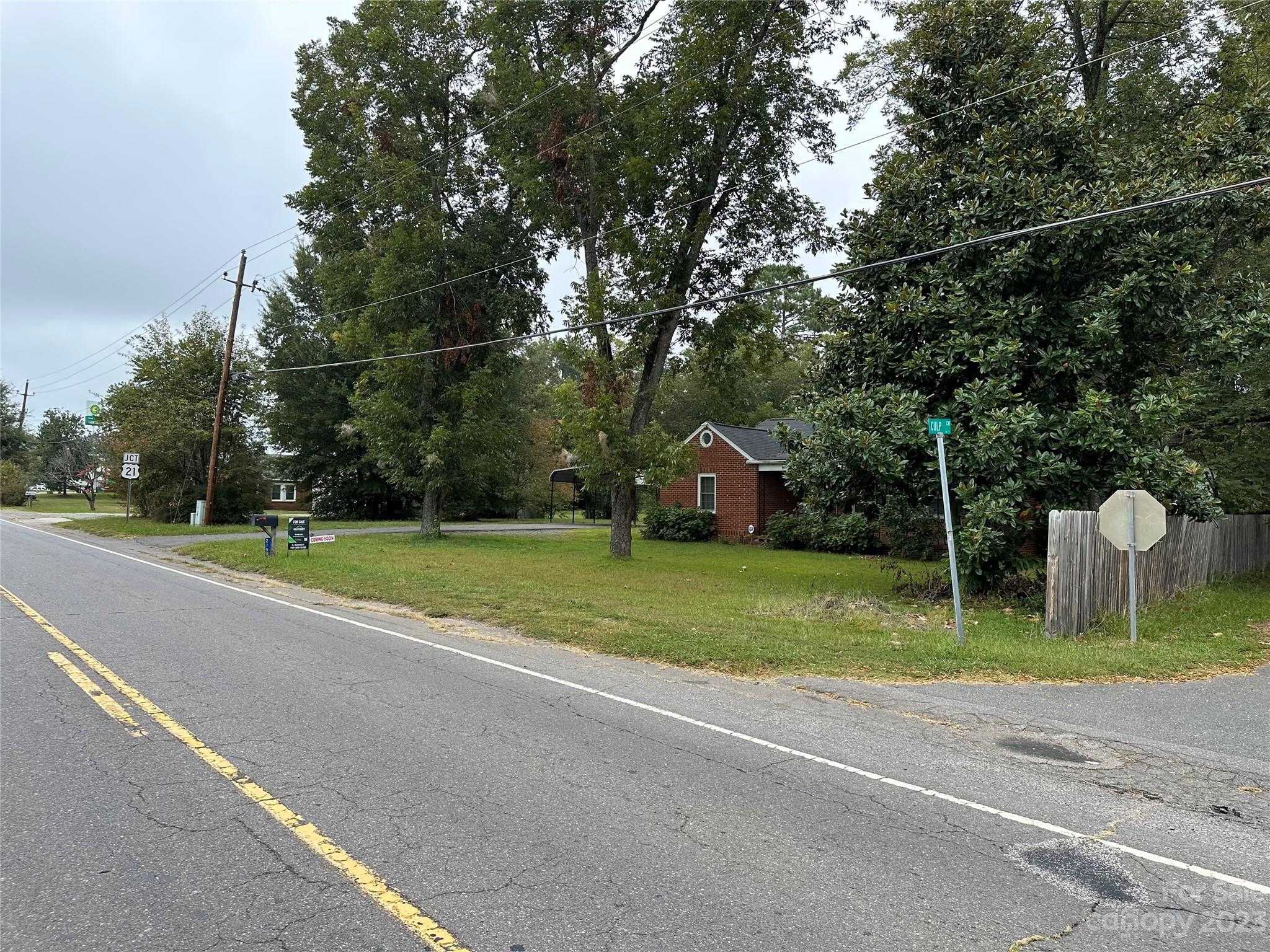 2159 Lesslie Highway Rock Hill, SC 29730 - Photo 5 of 5 a view of a house with a big yard and large trees