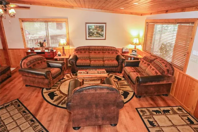 a bedroom with furniture and a mirror