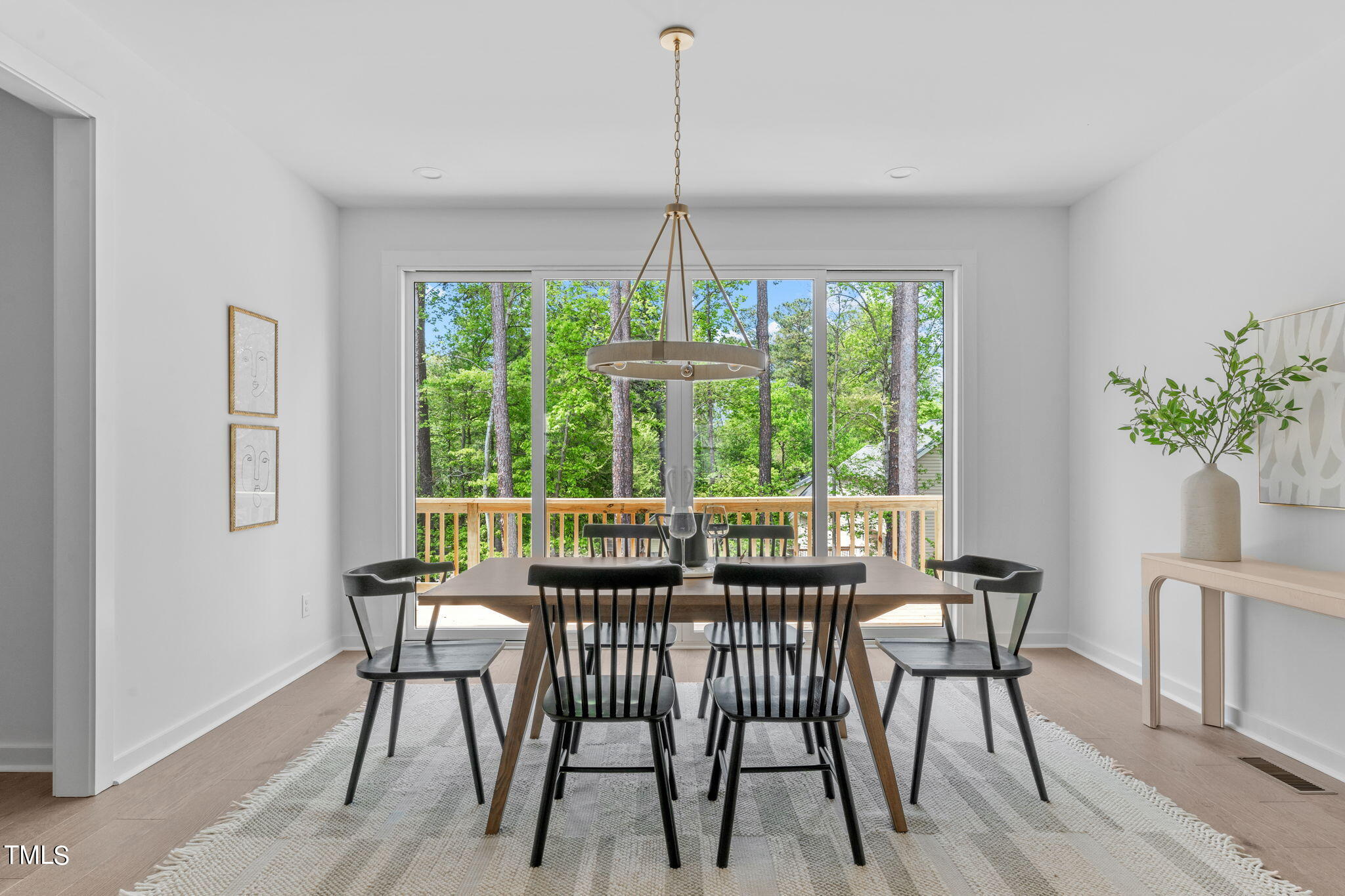 6408 Tanner Oak Lane Raleigh, NC 27613 - Photo 14 of 49 a dining room with furniture window and outside view