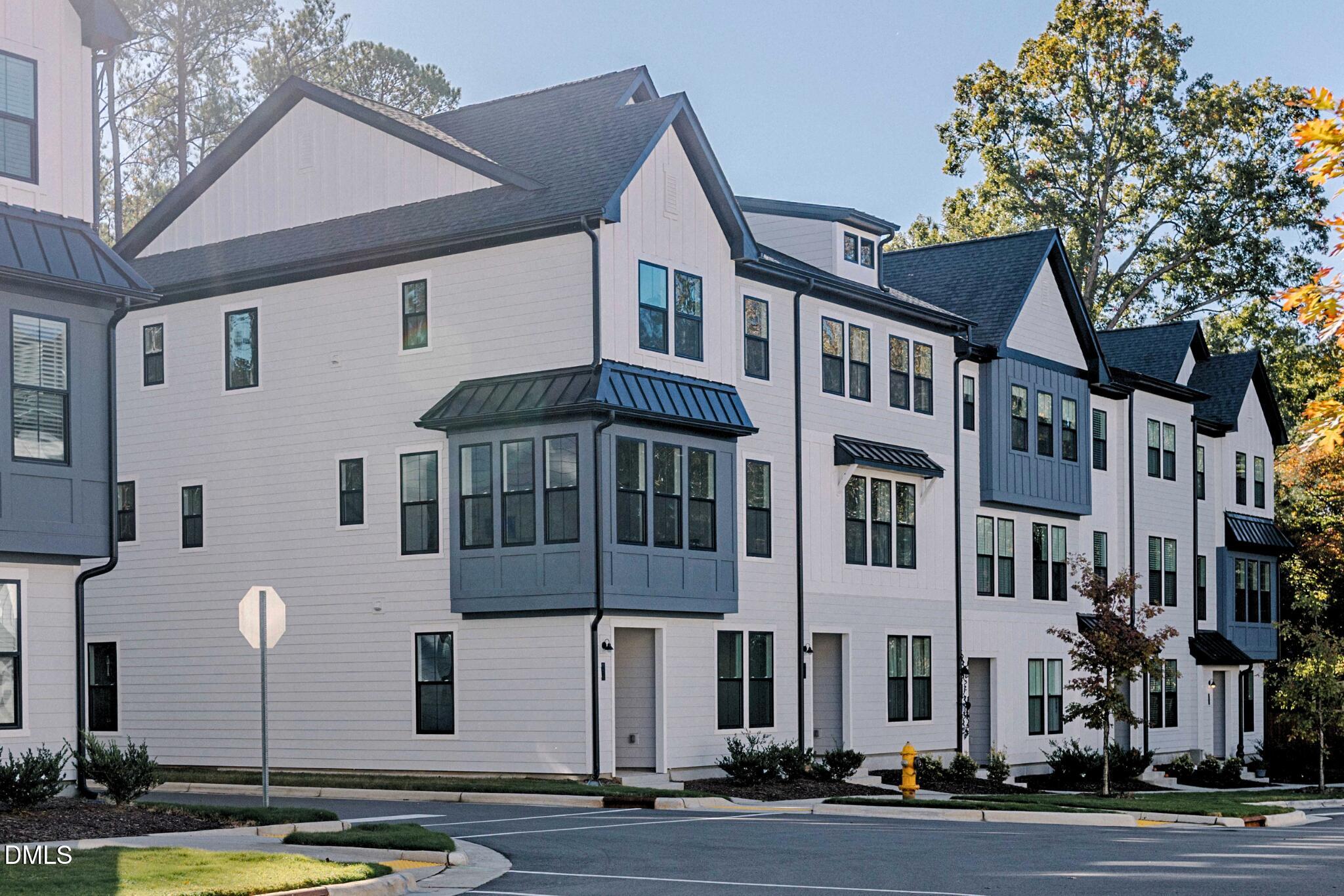 6408 Tanner Oak Lane Raleigh, NC 27613 - Photo 2 of 49 a front view of a building with street view