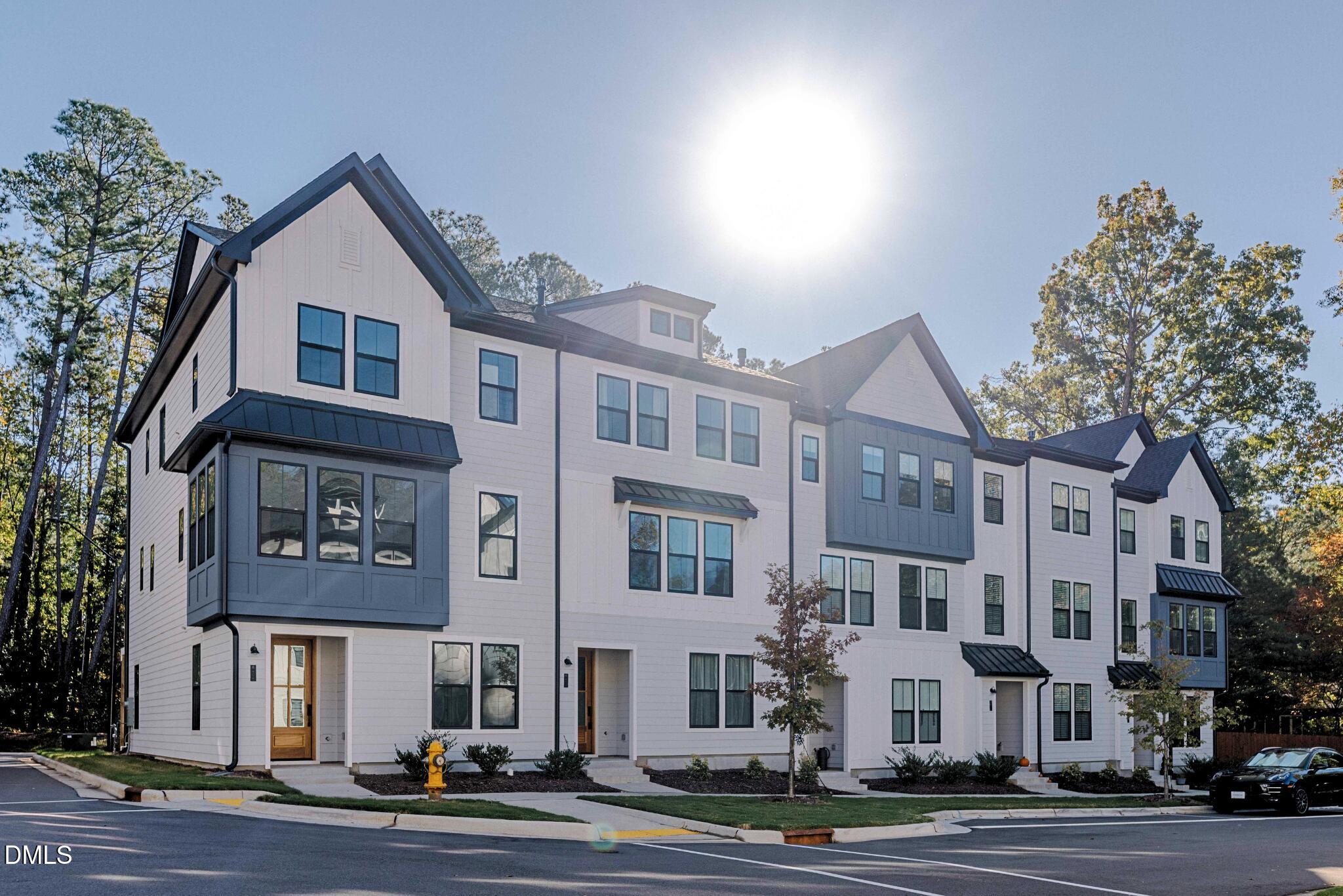 6408 Tanner Oak Lane Raleigh, NC 27613 - Photo 32 of 49 a front view of a building with street view