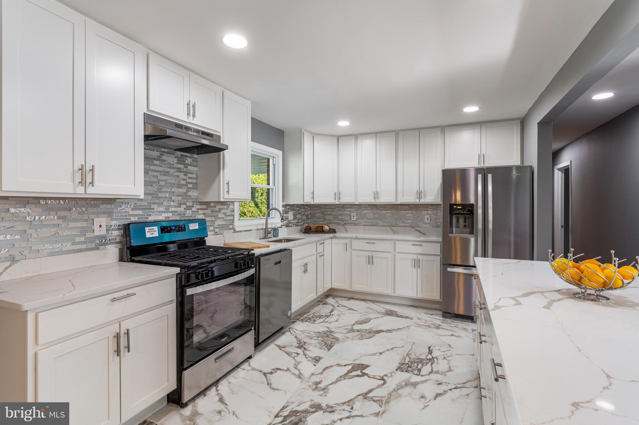 800 Flintlock Drive Bel Air, MD 21015 - Photo 12 of 55 a kitchen with a sink stainless steel appliances and cabinets
