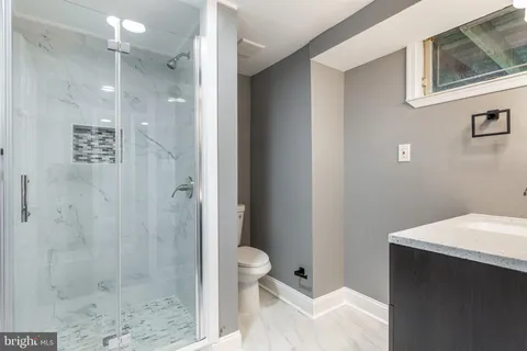 a bathroom with a sink a mirror and vanity