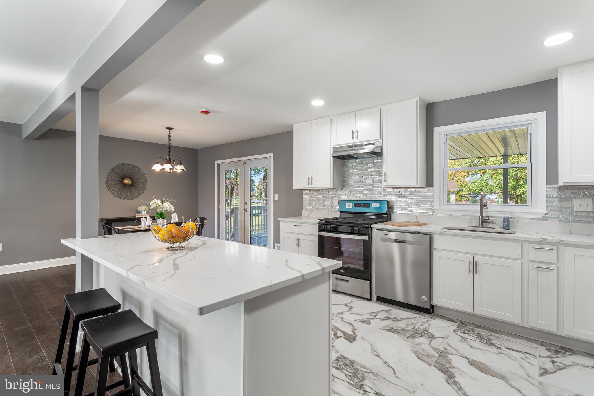 800 Flintlock Drive Bel Air, MD 21015 - Photo 7 of 55 a kitchen with granite countertop a sink stove and refrigerator