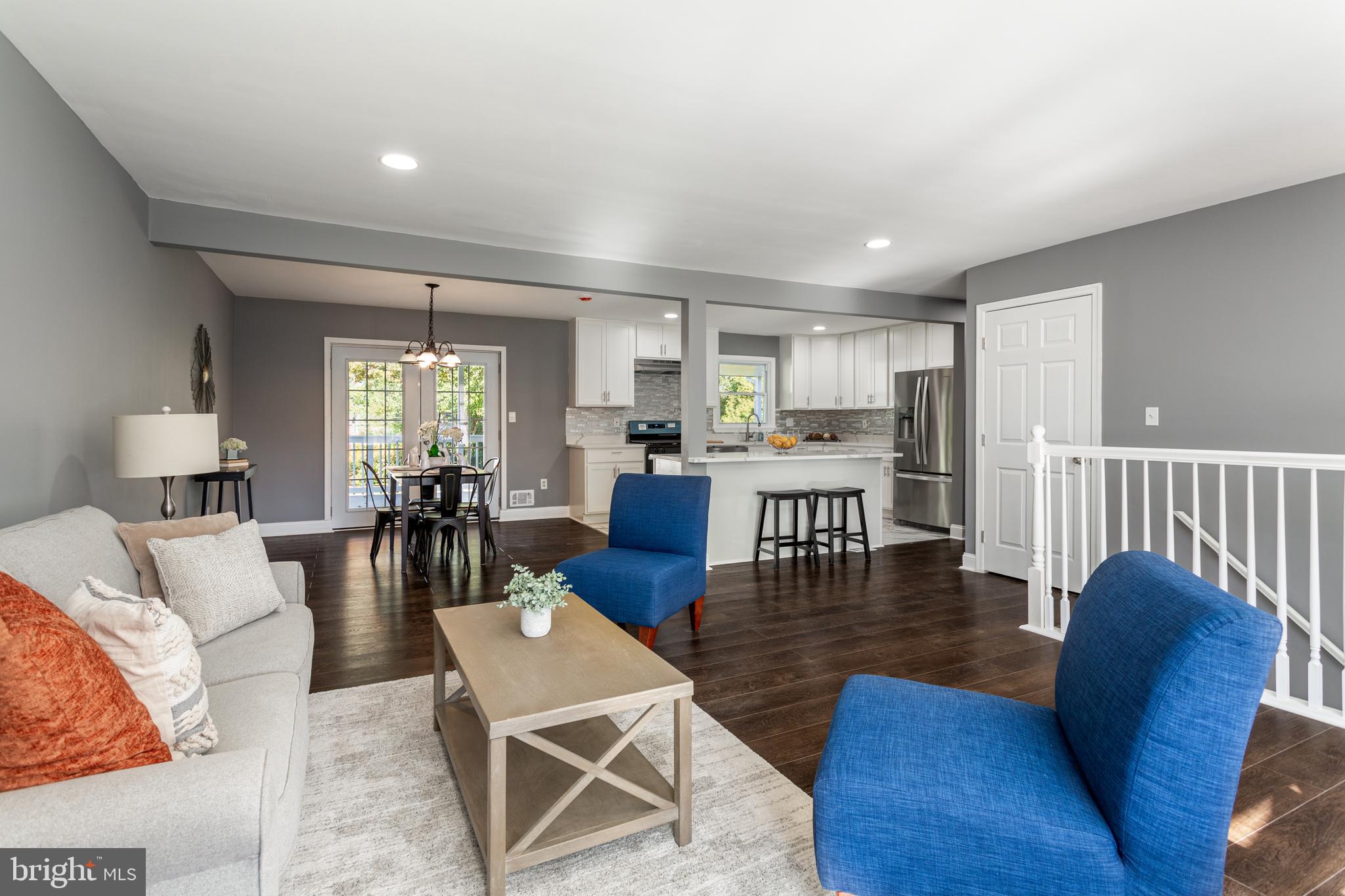800 Flintlock Drive Bel Air, MD 21015 - Photo 8 of 55 a living room with furniture wooden floor and a large window